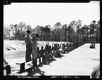 Men of the 51st Defense Battalion, the first combat unit trained at Montford Point, waiting to be called to rifle practice on the rifle range, March 1943.