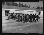 Marching new recruits to the Quartermasters for uniforms, March 1943.