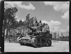 Training on a Stuart Light Tank with mounted 37 millimeter antiaircraft gun, March 1943.